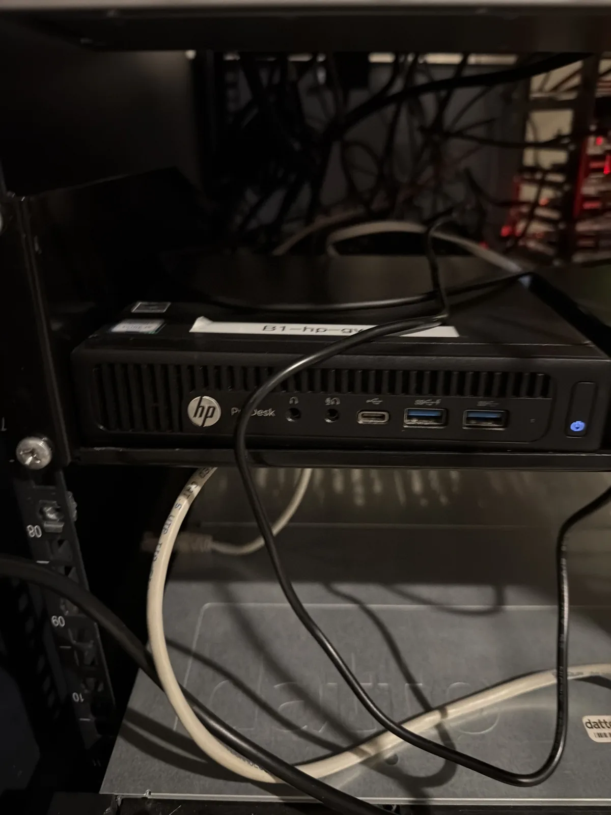 An HP EliteDesk 600 G3 mini PC that runs the core services